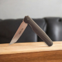 Джобен нож VexKnives в отворено положение на светъл фон Сгъваем нож VexKnives с танто острие от D2 стомана