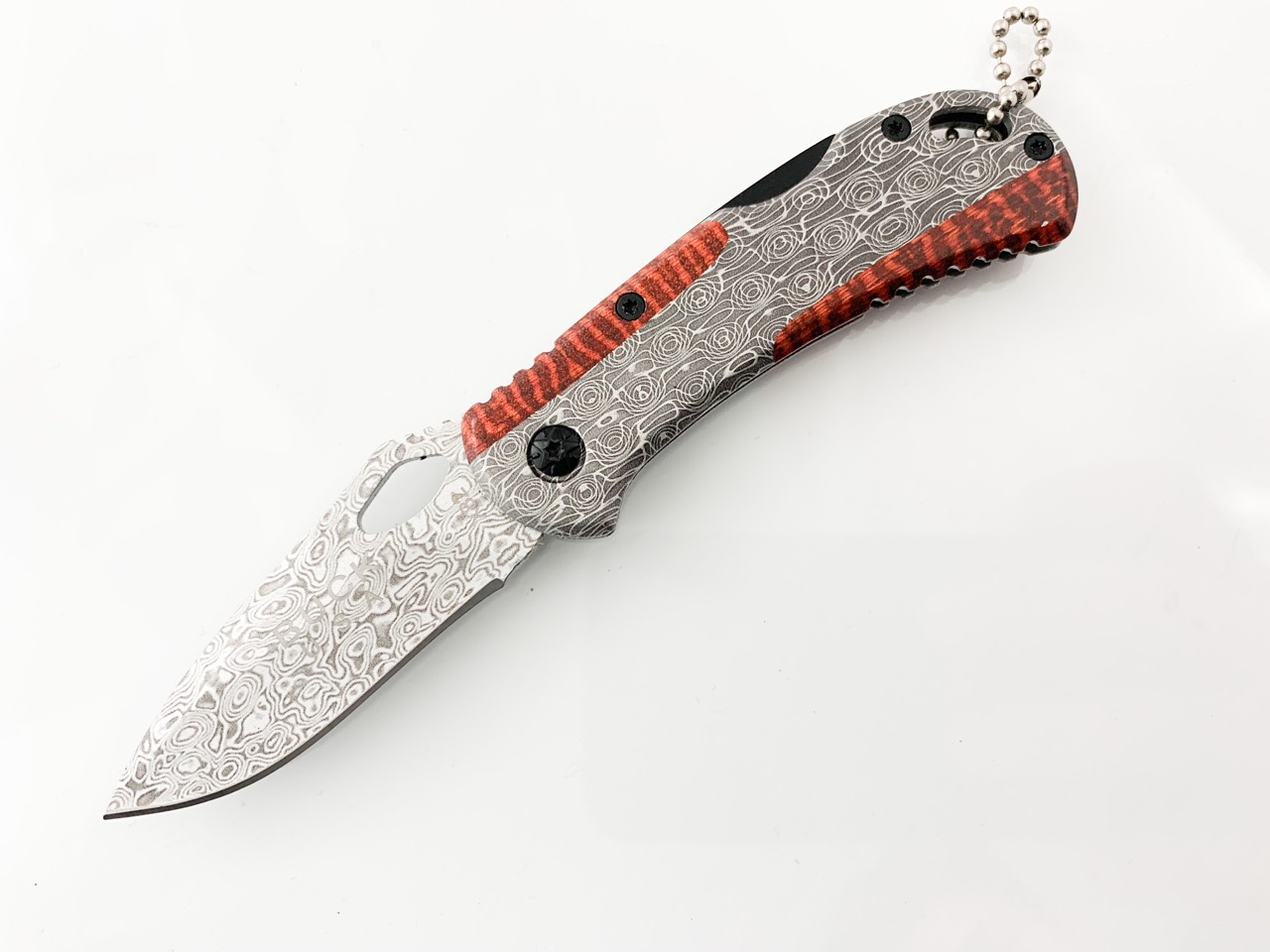 Сгъваем джобен нож с рисунка имитираща дамаска стомана Buck X82